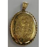 A 9ct gold oval locket with engraved decoration, 7gms