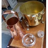 A brass coal/log bin together with a large beaten copper jug with handle and a silver rimmed glass