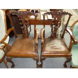 A pair of mahogany elbow chairs