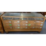 A shop display cabinet, 181 x 58 x 91 cm, glazed to three sides, the interior comprises a single