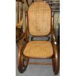 A Brentwood rocking chair with cane seat and back