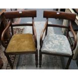 A Victorian pair of mahogany dining chairs with scroll arms and lift out bases