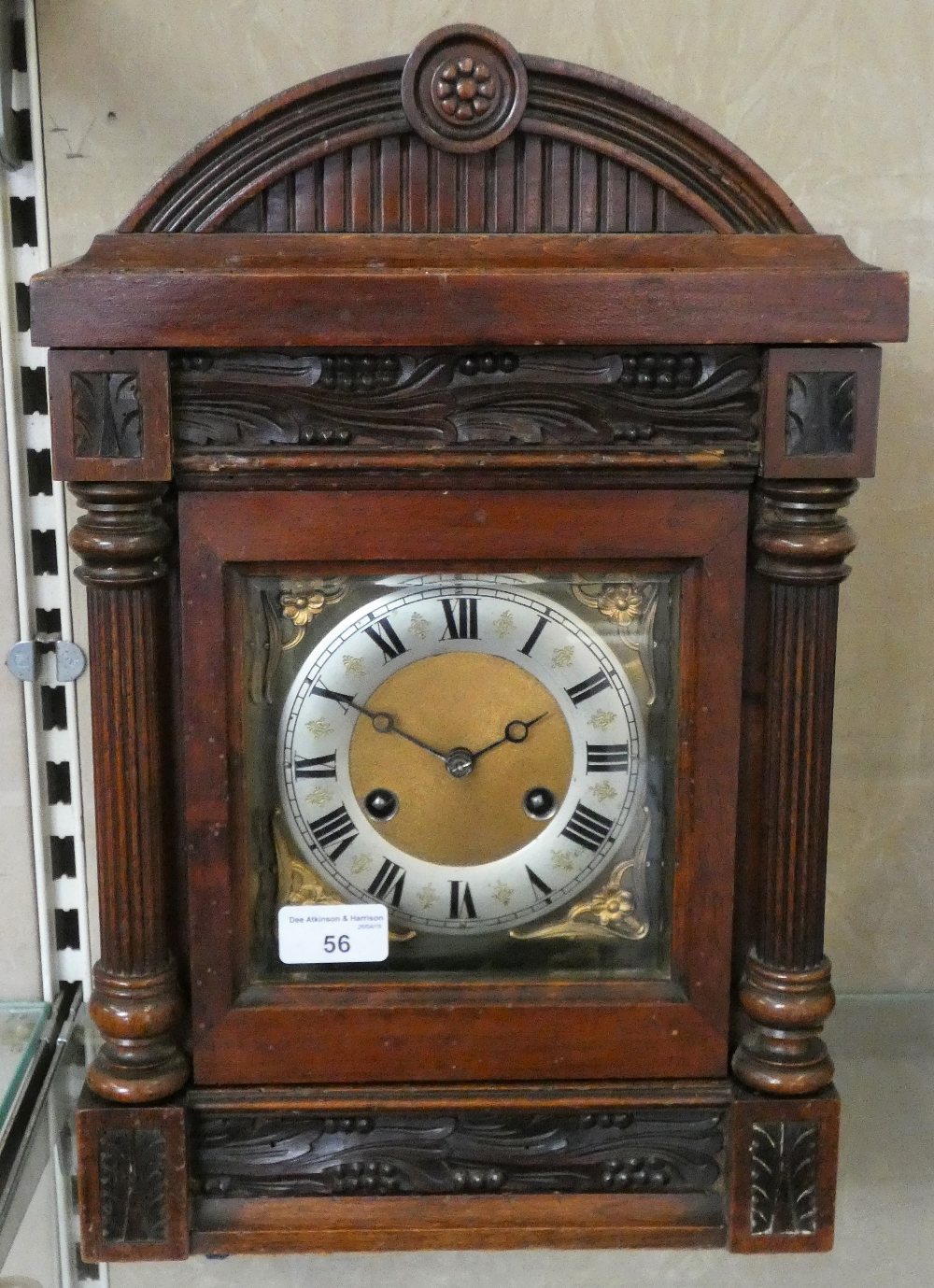 An oak mantle clock with domed top