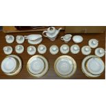 Royal Doulton dinner service, 'Royal Gold' pattern, twelve place settings, approximately sixty