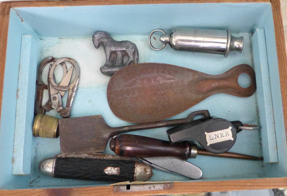 A jewellery box and contents including hat pins, badges, L.N.E.R. whistle and The ACME siren