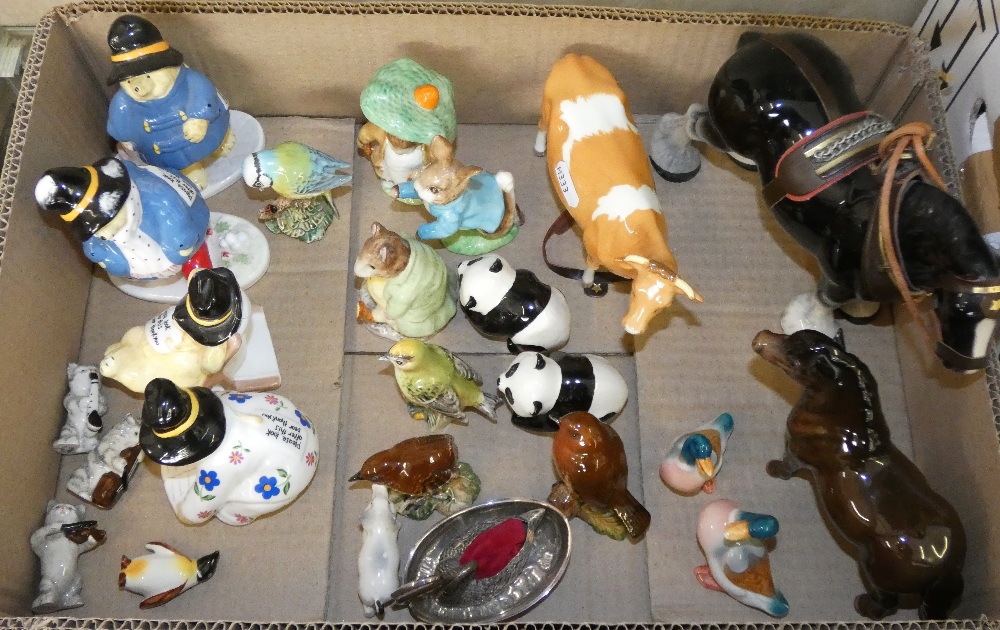 A box of animal and bird figures including a Beswick cow, pony, Bunnykins figures, birds, pandas,
