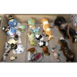 A box of animal and bird figures including a Beswick cow, pony, Bunnykins figures, birds, pandas,