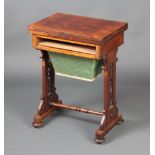 A Victorian rectangular rosewood work table with hinged lid, the base fitted a deep basket and
