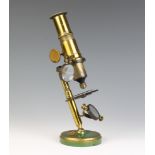 A student's 19th Century brass single pillar microscope