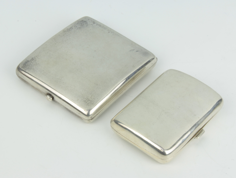 Two Edwardian silver cigarette cases Birmingham 1907 and 1908, 252 grams