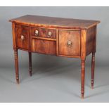 A Regency mahogany bow front sideboard fitted 1 long drawer above a secret drawer raised on ring