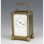 A 19th Century French 8 day carriage timepiece with enamelled dial and Roman numerals contained in a