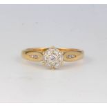 An 18ct yellow gold diamond cluster ring size M 1/2