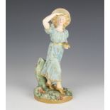 A Royal Worcester figure of a lady holding a birds nest filled with eggs 1293 23cm