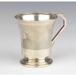 An Art Deco silver mug with engine turned decoration and angular handle Birmingham 1937 8cm, 86