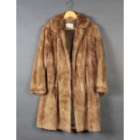 A lady's light fur coat by David Jackson Ltd Eastbourne and Worthing