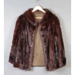 A lady's quarter length mink fur coat by Louis Fine Furs