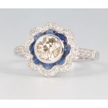 An 18ct white gold sapphire and diamond ring, the centre brilliant cut stone approx. 0.9ct, size N