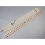 A Pegley Davies 2 piece 11' split cane beach casting fishing rod contained in a cloth bag