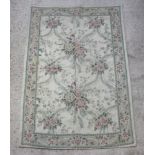 A Kashmiri floral pattern wool throw/rug 181cm x 120cm