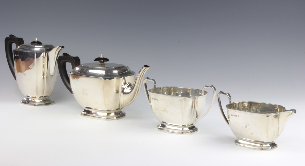 A silver 4 piece Art Deco tea set with ebony mounts and engraved monogram Birmingham 1938, maker