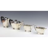 A silver 4 piece Art Deco tea set with ebony mounts and engraved monogram Birmingham 1938, maker