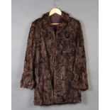 A lady's brown Persian lamb jacket Slight split to the arm seem