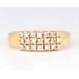 An 18ct yellow gold 21 stone diamond ring, size M, 5.4 grams