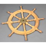A hardwood and brass mounted 8 spoked ships wheel 86cm diam.