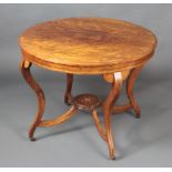 A circular Victorian inlaid rosewood occasional table raised on 4 cabriole supports with X framed