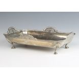 A rectangular silver dish with pierced handles on claw feet, Sheffield 1912, 24cm 470 grams