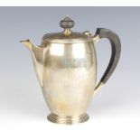 An Art Deco silver coffee pot with ebonised mounts Sheffield 1936, gross 501 grams