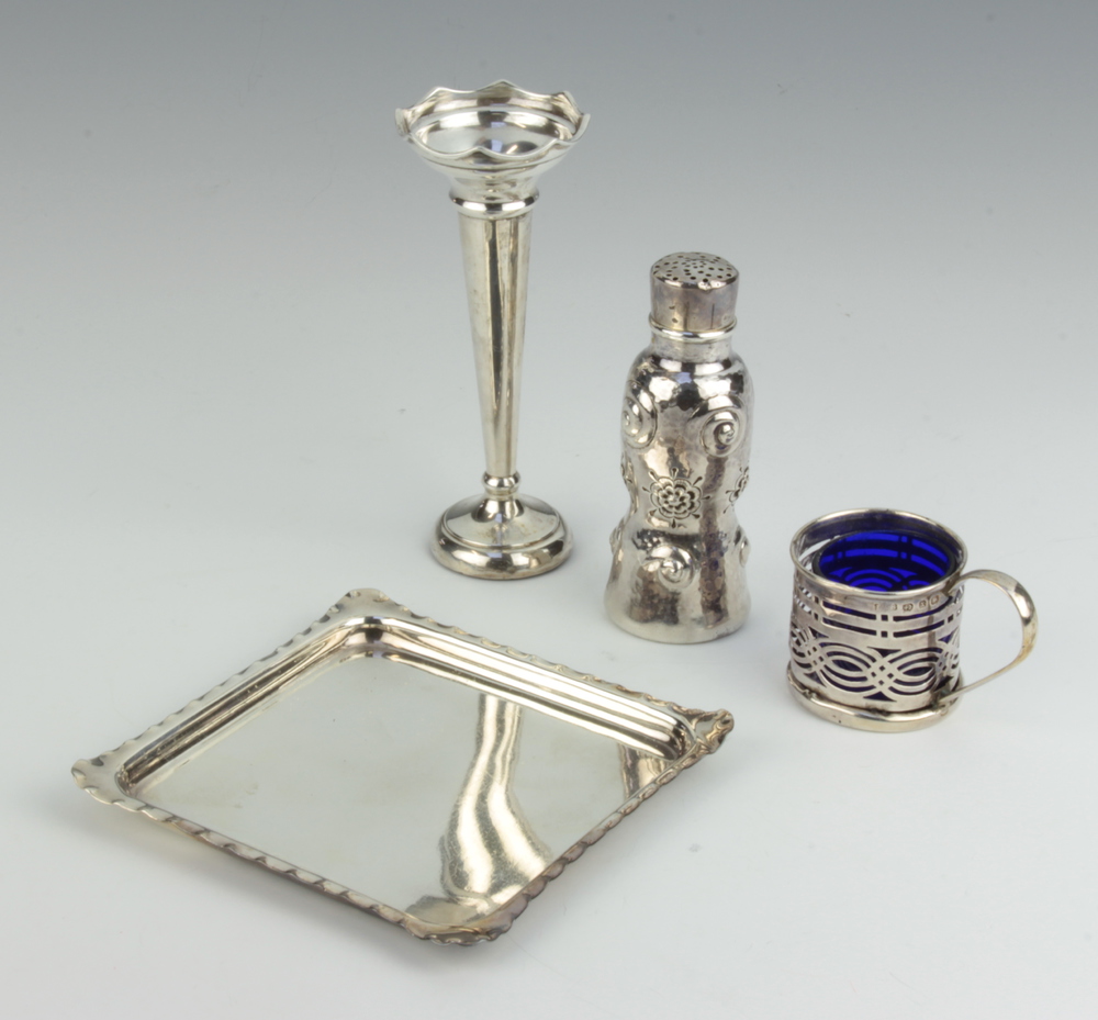 A sterling silver repousse pepper 9cm, a posy vase, a mustard holder and tray, 130 grams of