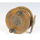 A Milwards Mariner wooden and brass star back fishing reel