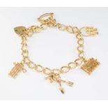 A 9ct yellow gold charm bracelet with padlock 20.5 grams