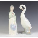 A Nao figure of a goose 23cm and a ditto girl holding her hat 23cm