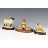 A Border Fine Arts figure of an English black faced sheep on a wooden base 14cm (ear chipped), a