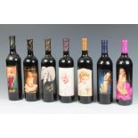 Seven bottles of red wine all decorated with labels bearing images of Marilyn Monroe, comprising a