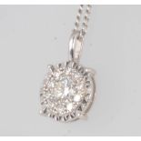 An 18ct white gold diamond cluster pendant 0.5ct on a 9ct white gold chain