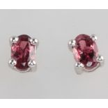 A pair of silver and tourmaline ear studs 1.2ct