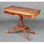 A William IV rectangular mahogany tea table raised on a turned column and rectangular base, raised