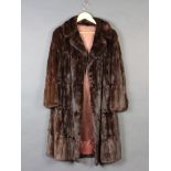 A lady's brown full length mink fur coat Some wear to the lapels