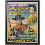 A Belgian movie poster for the John Wayne Film "The Searchers" ( La Prisonniere Du Desert ),