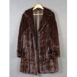 A lady's full length brown mink fur coat