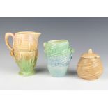 A Sylvac beige preserve pot 1365 11cm, a ditto vase 684 12cm and a jug 16cm