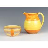 An Art Deco Shelley jug with broad yellow and orange decoration 14cm and a ditto deep bowl 6cm The