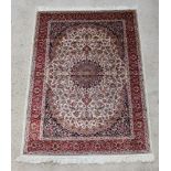 A brown and floral patterned Kashan style Belgian cotton rug with central medallion 190cm x 140cm