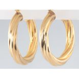 A pair of 9ct yellow gold hollow hoop earrings, 2.4 grams