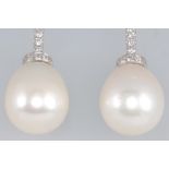 A pair of 18ct white gold pearl and diamond drop earrings