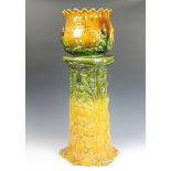 A Bretby style green glazed jardiniere and stand 82cm Minor chips to the base of the stand